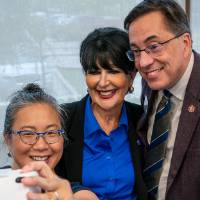 President Mantella taking selfie with event attendees